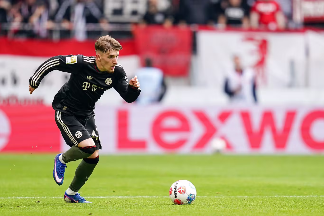 FREIBURG IM BREISGAU, GERMANY - APRIL 04: Lennart Karl of FC Bayern Munich goes forward during the Bundesliga match between SC Freiburg and FC Bayern München at Europa-Park Stadion on April 04, 2026 in Freiburg im Breisgau, Germany. (Photo by Daniela Porcelli/Getty Images)